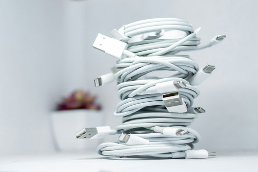 A collection of many charging cables that can charge electronic devices via USB-C