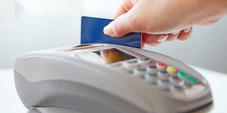 payment terminal reading a bank card